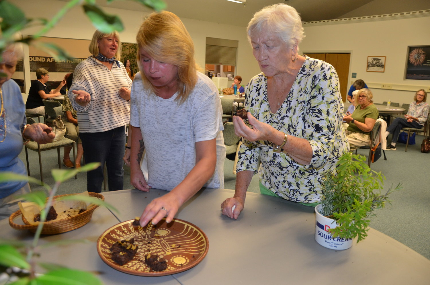 Members of the Country Gardeners Club tasted Marcia Dunsmore's chocolate zucchini bread and chocolate Afghan cookies.